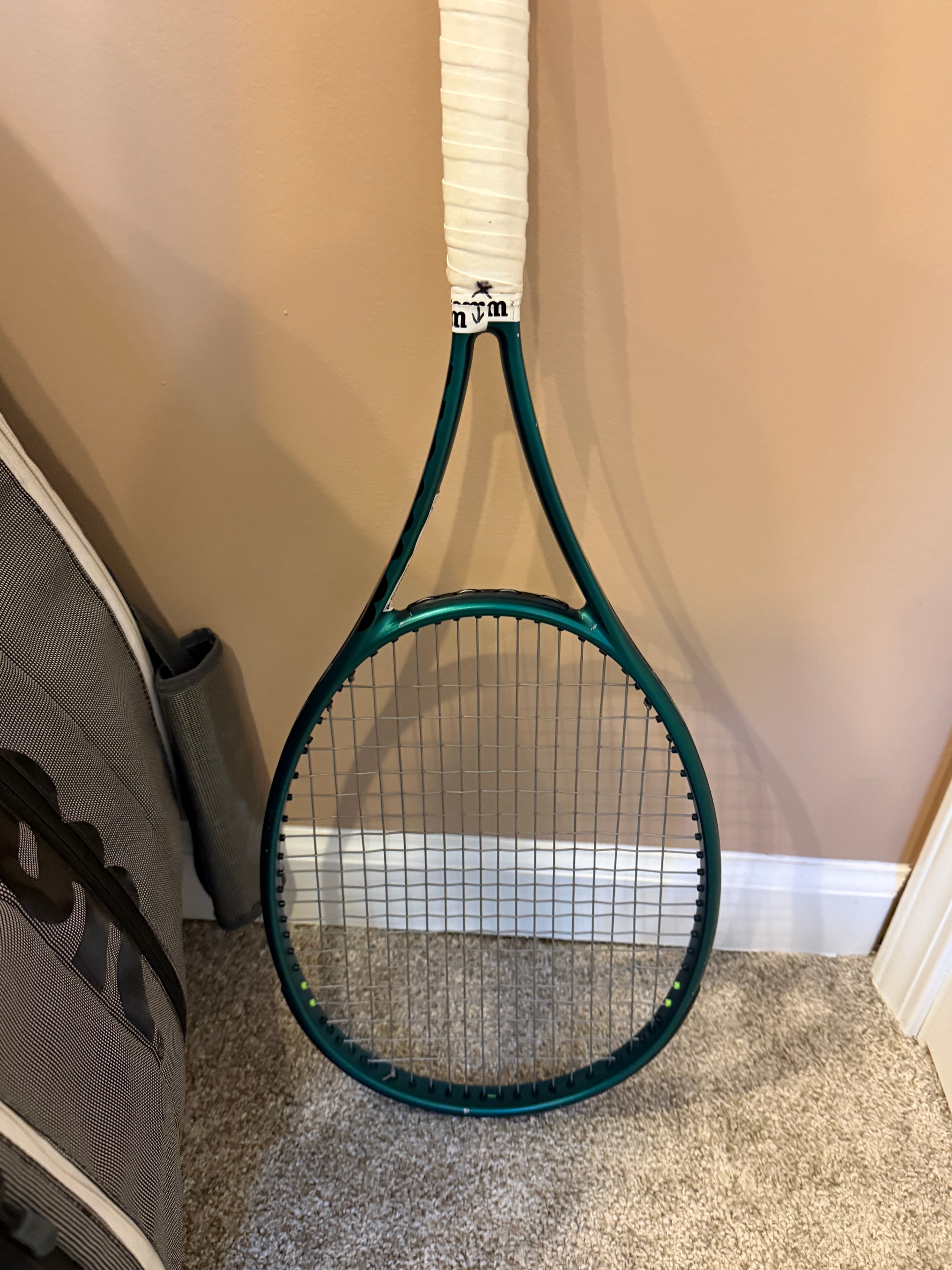 Freshly strung Wilson Blade racket